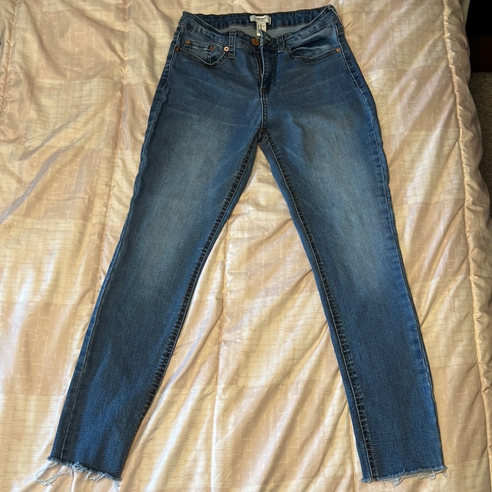 Woman’s size 28 Forever 21 blue jeans. Skinny with distressed ends